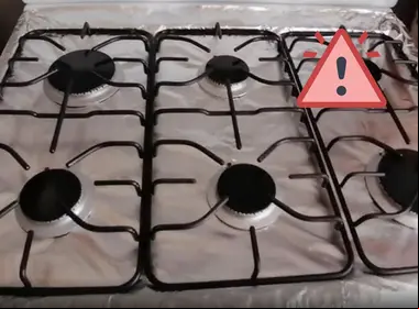 Forra estufa con papel aluminio 
